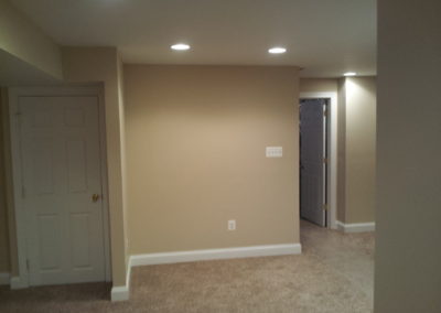 Room with beige carpet and walls (view 3).