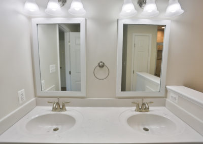 Master Bath View 3- Dual sinks, white countertop, 2 mirrors.